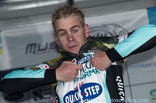 Julien Vermote (Omega Pharma-Quickstep) puts on the leader's jersey.