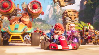 Donkey Kong, Mario, Peach and Cranky Kong (L-R) in Mario Kart vehicles in The Super Mario Bros. Movie. 