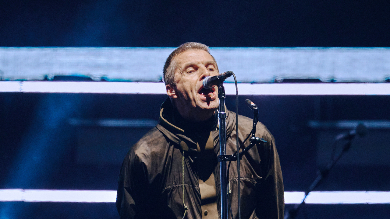 Liam Gallagher singing on stage