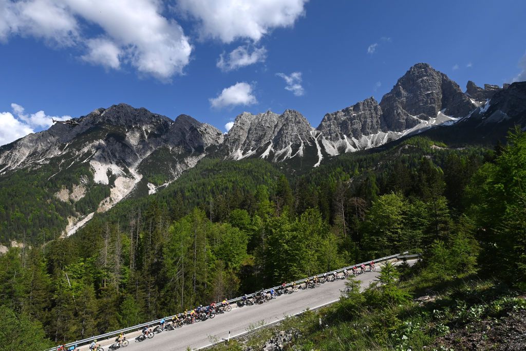 VAL DI ZOLDO PALAFAVERA ITALY MAY 25 Joo Almeida of Portugal and UAE Team Emirates White Best Young Rider Jersey Geraint Thomas of The United Kingdom and Team INEOS Grenadiers Pink Leader Jersey and A general view of the peloton climbing to the Forcella Cibiana 1530m during the 106th Giro dItalia 2023 Stage 18 a 161km stage from Oderzo to Val di Zoldo Palafavera 1514m UCIWT on May 25 2023 in Val di Zoldo Palafavera Italy Photo by Tim de WaeleGetty Images