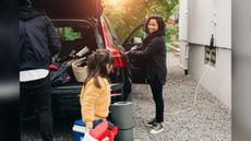 A family unloads their electric car