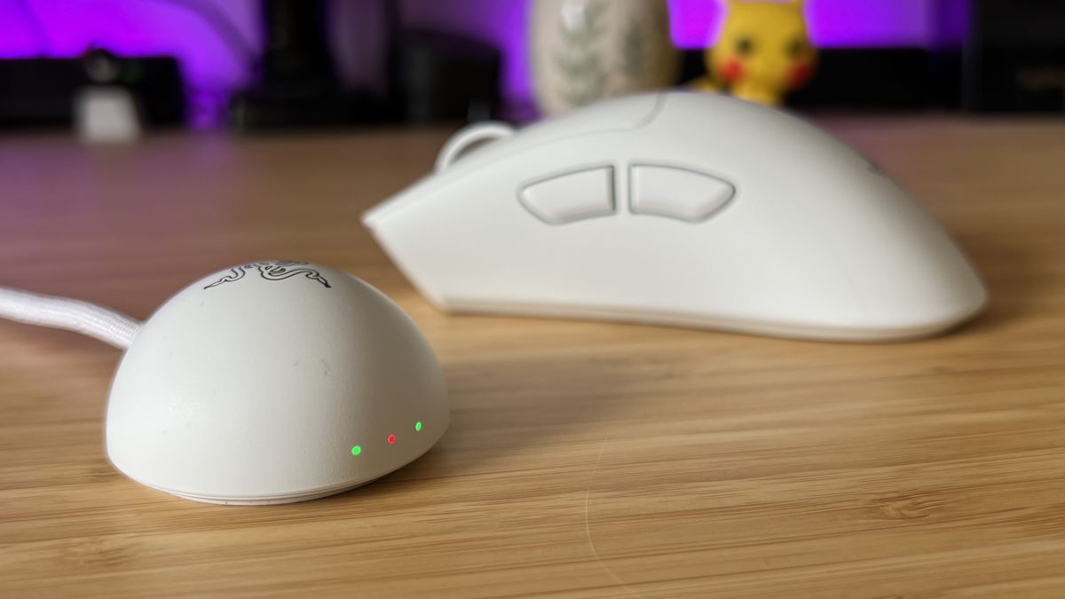 Razer 8,000Hz receiver with Deathadder V4 Pro gaming mouse in the background