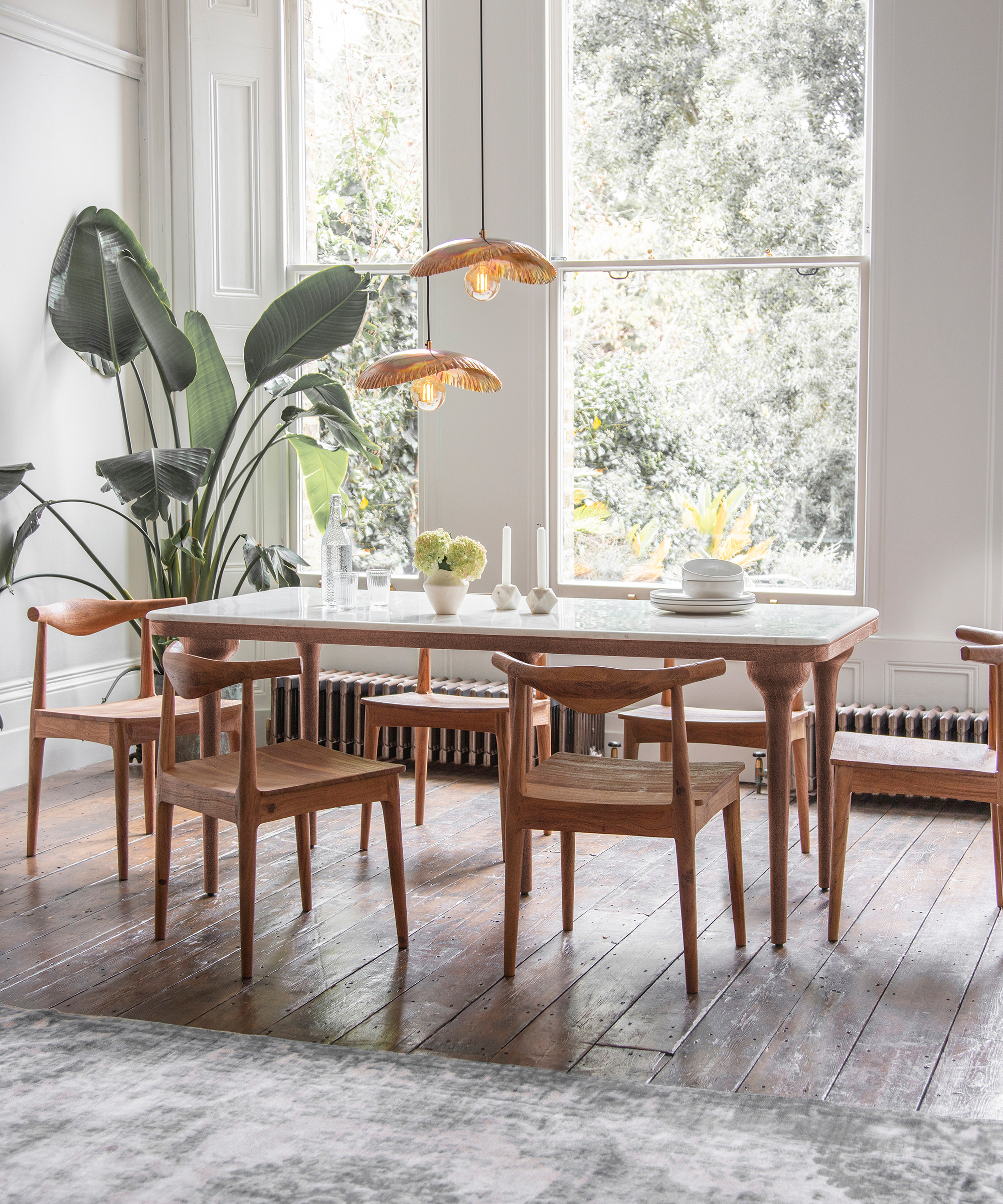 mid century wood dining chairs around a wood dining table