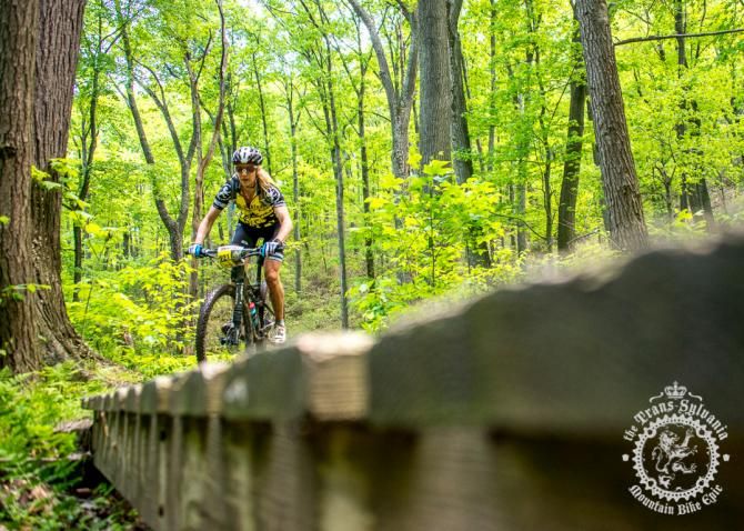 Kristin Walters rides across one of the Three Bri dges near Tussey Mountain