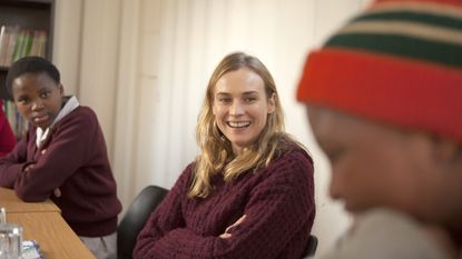 Diane Kruger talks to children at a Global Fund meeting