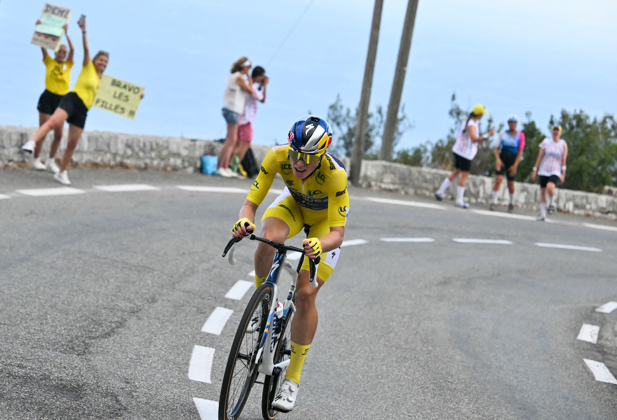 FDJ-SUEZ's Dutch rider Demi Vollering wearing the overall leader's yellow jersey on the final stage of the Tour de France Femmes