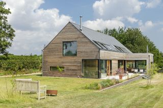cottage style timber frame house in the countryside