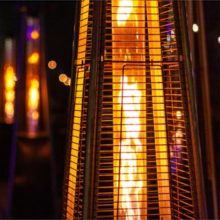 Closeup of gas patio heater with flames