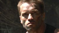Close-up on Dutch's face as he looks for the creature in Predator (1987)
