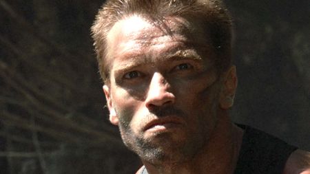 Close-up on Dutch's face as he looks for the creature in Predator (1987)