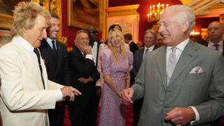 British singer Rod Stewart (L), English former football player David Beckham (2nsd L) and British actress Sienna Miller (C) speak with Britain's King Charles III (R) during the inaugural King's Foundation charity awards at St James' Palace, in central London, on June 11, 2024