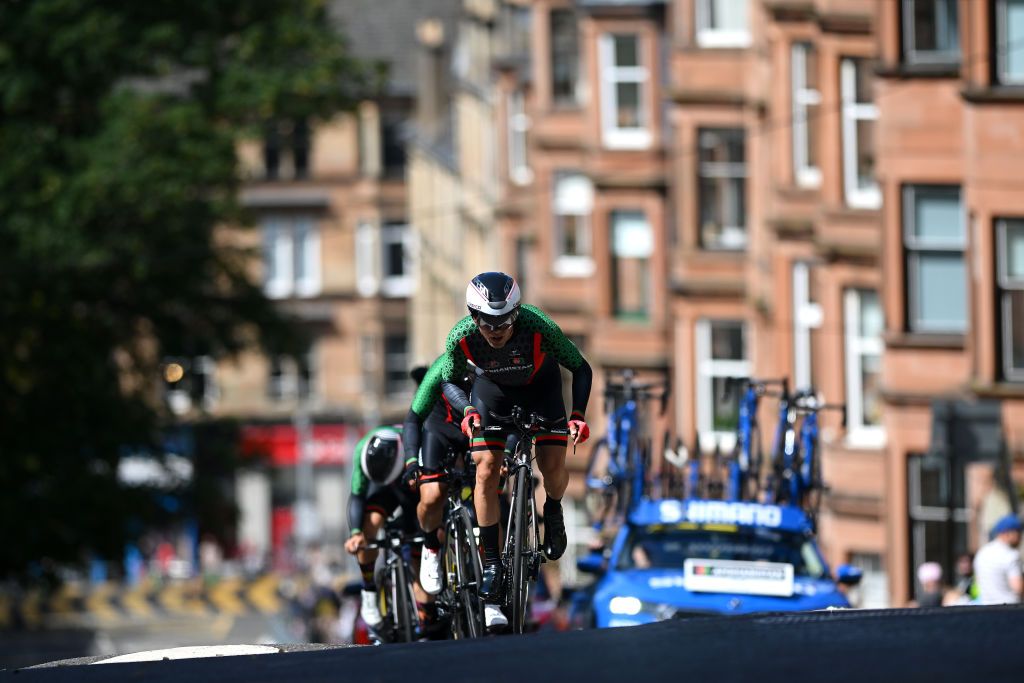 GLASGOW SCOTLAND AUGUST 08 Qais Haidari Mohamad Islam Jorat Ahmad Mirzaee and Team Afghanistan sprint during the Team Time Trial Mixed Relay a 403km race from Glasgow to Glasgow at the 96th UCI Cycling World Championships Glasgow 2023 Day 6 UCIWT on August 08 2023 in Glasgow Scotland Photo by Dario BelingheriGetty Images