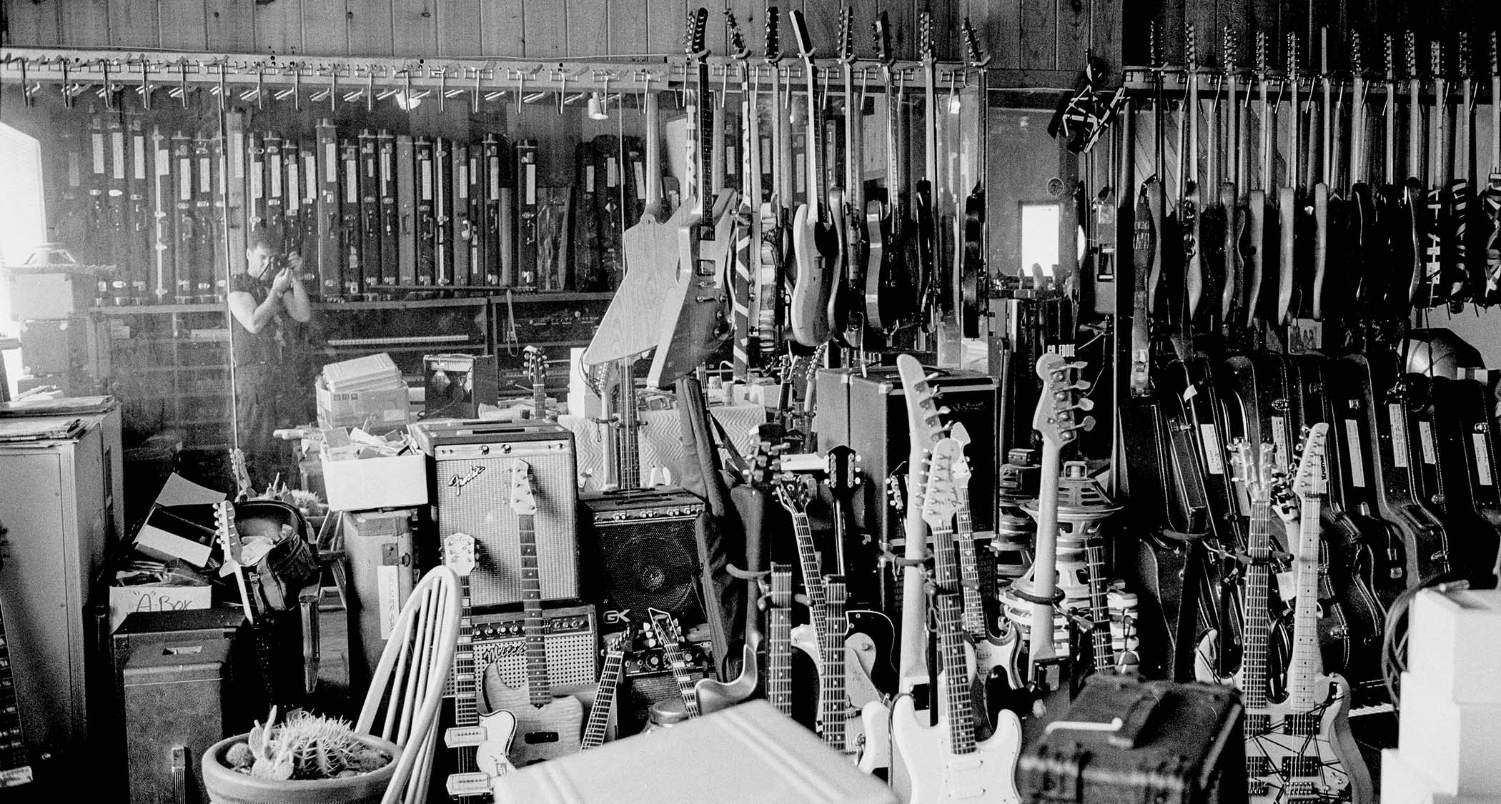 Larry photographing the guitar repair and storage room upstairs at Eddie Van Halen’s 5150 Studios, Los Angeles, in 1993