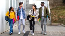 group of college students walking and talking for scholarships story