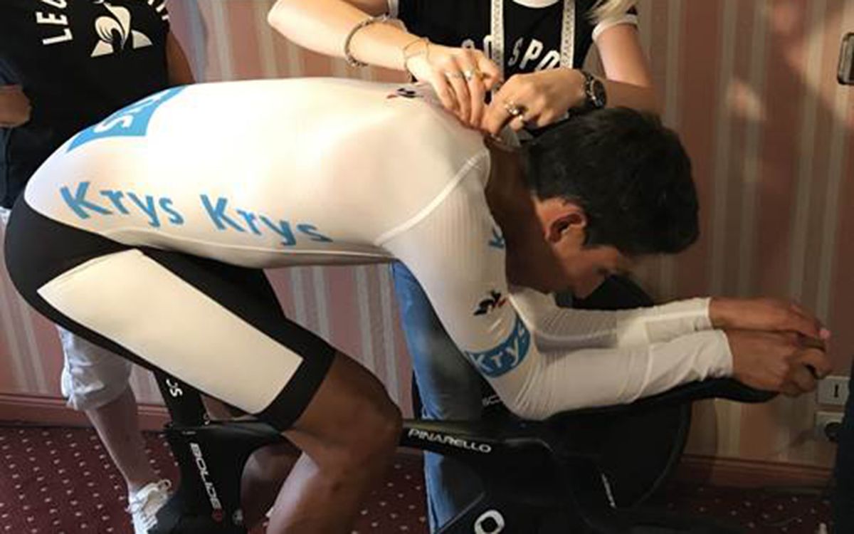 Egan Bernal gets his suit measured at his team hotel the night before the time trial