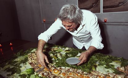 Artist-chef Paul Renner serving up open-faced sandwiches at The Watermill Center Pre-Summer Party, held at Spring Place in New York