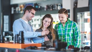 Couple being shown camera in a camera store