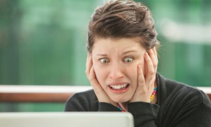 Woman gasping at computer
