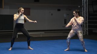 Peyton List as Tory Nichols, Mary Mouser as Samantha LaRusso in Cobra Kai.