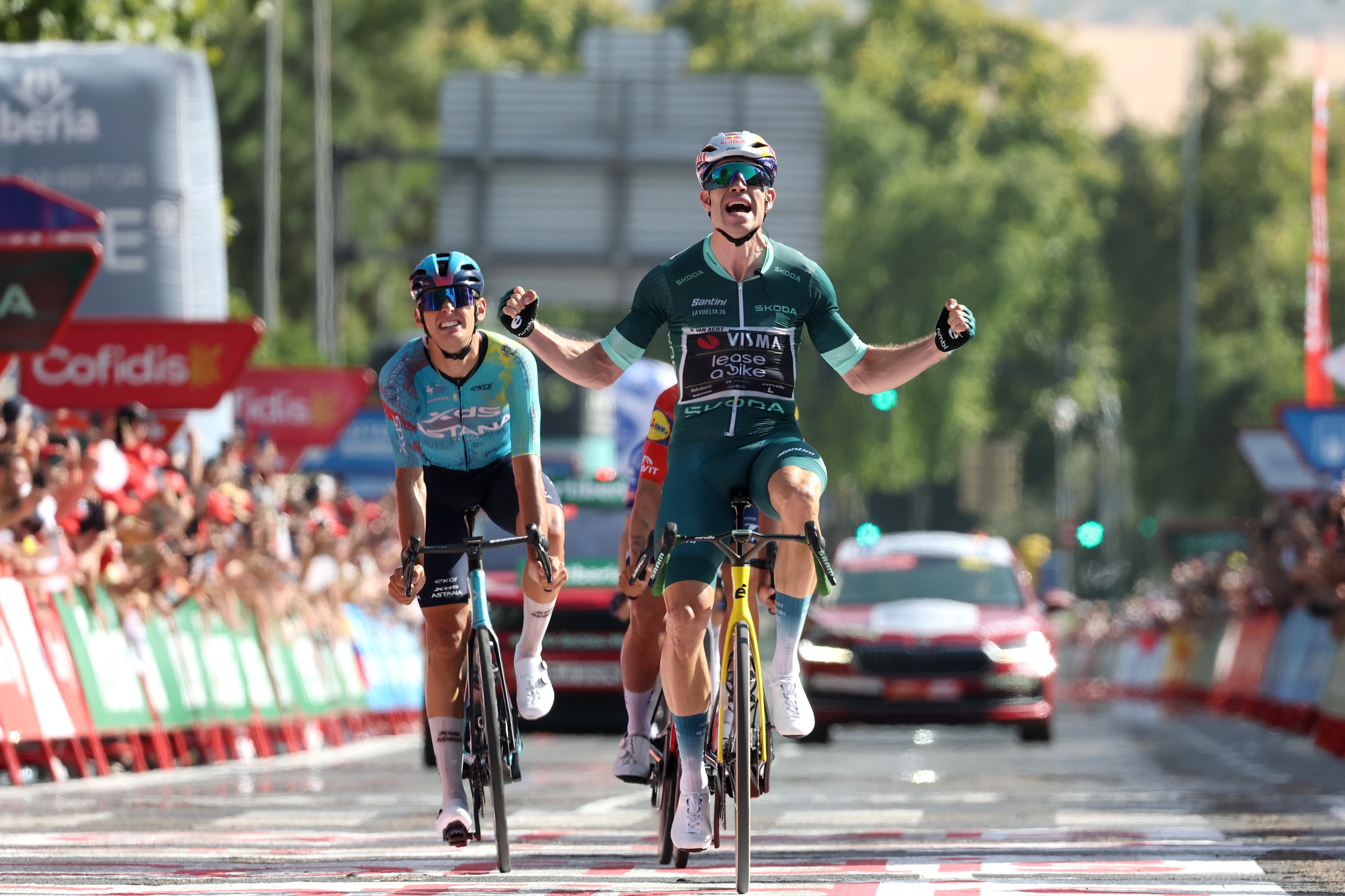 Wout Van Aert of Visma-Lease a Bike in the green jersey celebrates at the finish line as stage winner ahead of Alessandro Romele during the Vuelta a Espana, Stage 15 a 110.2km stage from Palma del Rio to Cordoba.