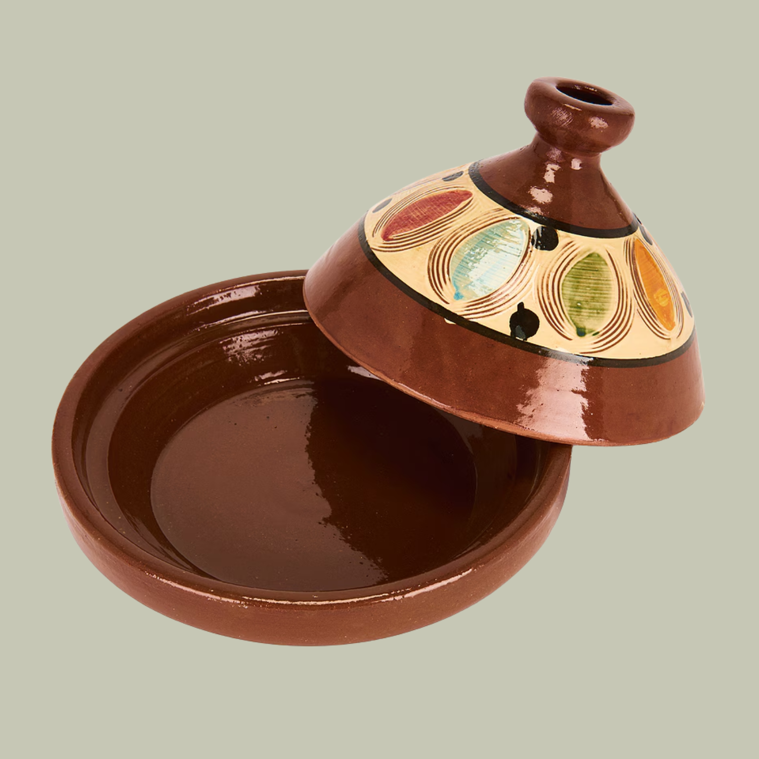 A brown tagine with a pattern on the lid