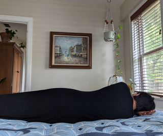 A woman lying on the Stearns & Foster Estate Mattress.