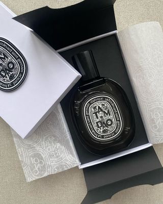 a picture of Diptyque Tam Dao perfume and box