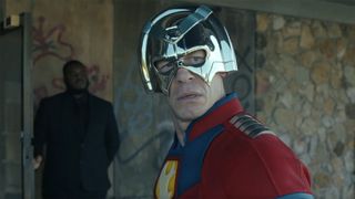 Chris Smith looking behind him as he wears his metahuman costume in Peacemaker season 2 episode 1