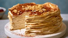 Tiramisu crepes stacked topped with amaretti biscuits and toasted almonds
