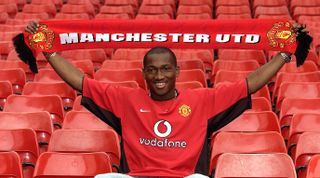 MANCHESTER, ENGLAND - JULY 3: Eric Djemba-Djemba signs for Manchester United on July 30, 2003. (Photo by Matthew Peters/Manchester United via Getty Images)