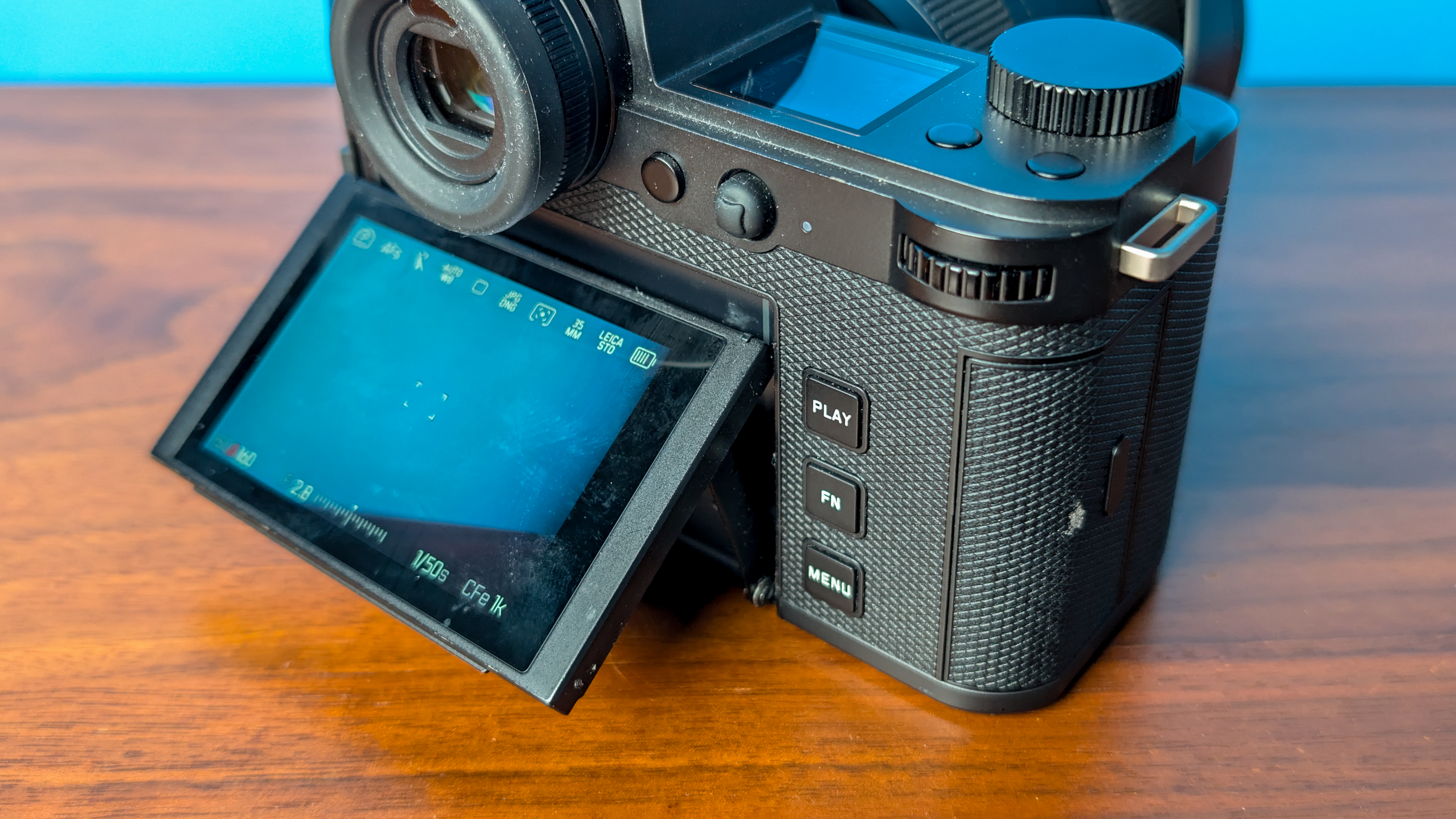 A black Leica SL3-S mirrorless camera