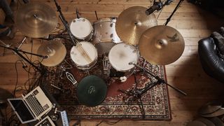 Overhead image of drum kit miked up ready to record