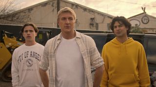 Tanner Buchanan as Robby Keene, William Zabka as Johnny Lawrence, Xolo Maridueña as Miguel Diaz in Cobra Kai. Cr. Courtesy of Netflix © 2024