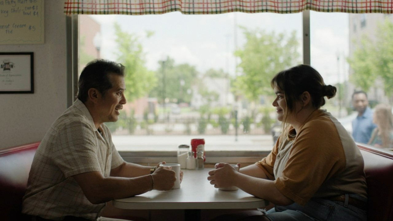 Barbie Ferreria and John Leguizamo talking at a diner in Bob Trevino Likes It.