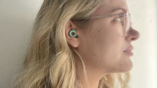 TechRadar writer Becca Caddy wearing the Loop Quiet earplugs in Mint