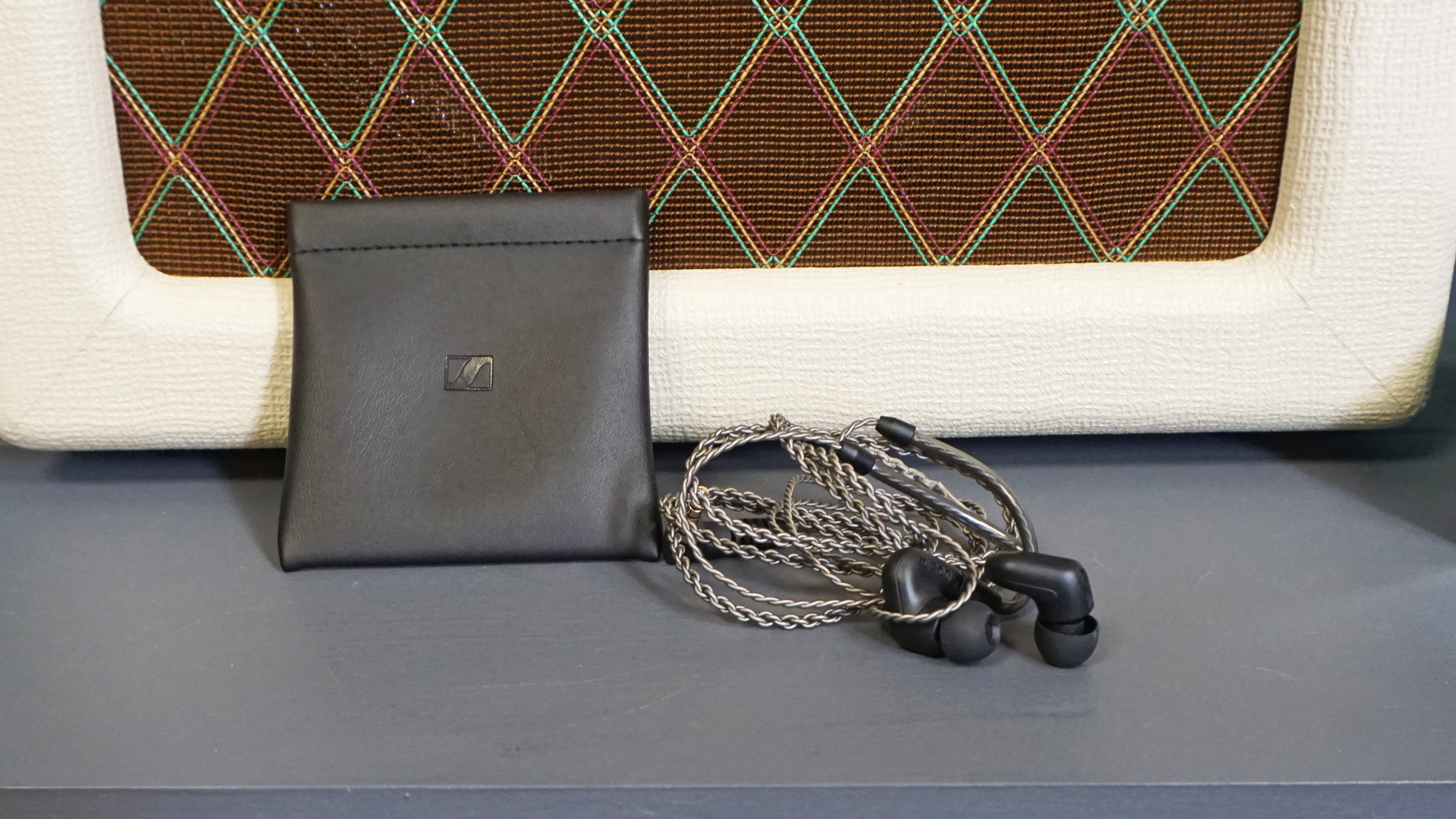 Sennheiser IE 200 next to carry pouch