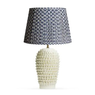 White bedside lamp with a patterned shade 