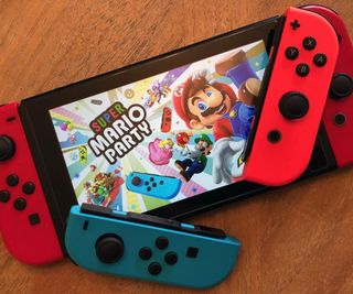 Nintendo Switch with Joy-Cons and Super Mario Party