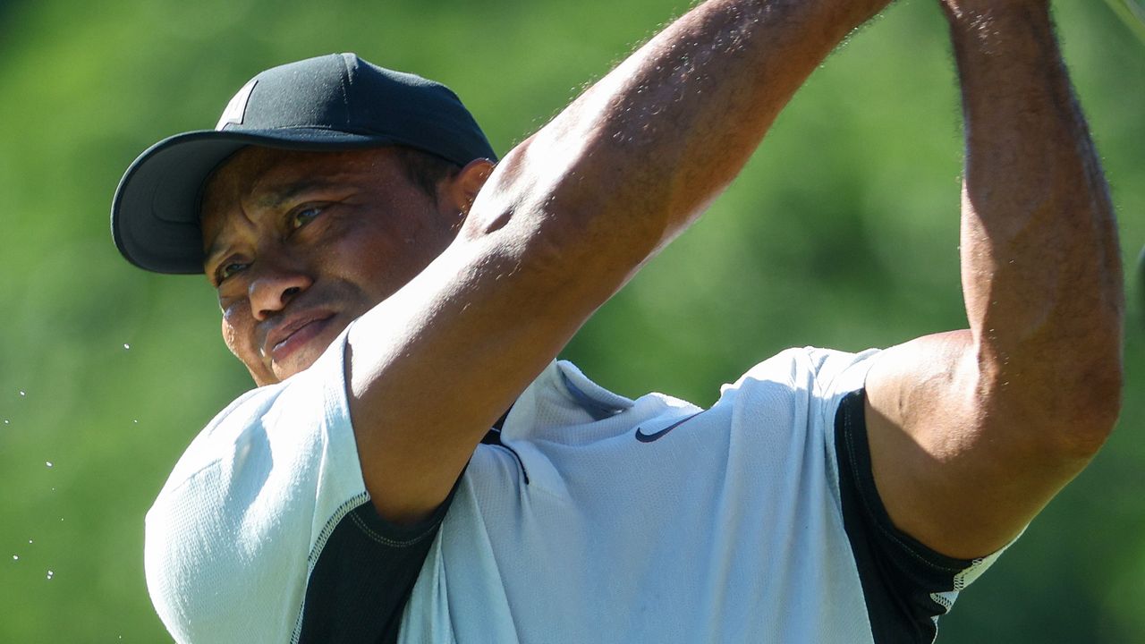 Tiger Woods plays a tee shot during a practice round before the 2022 PGA Championship