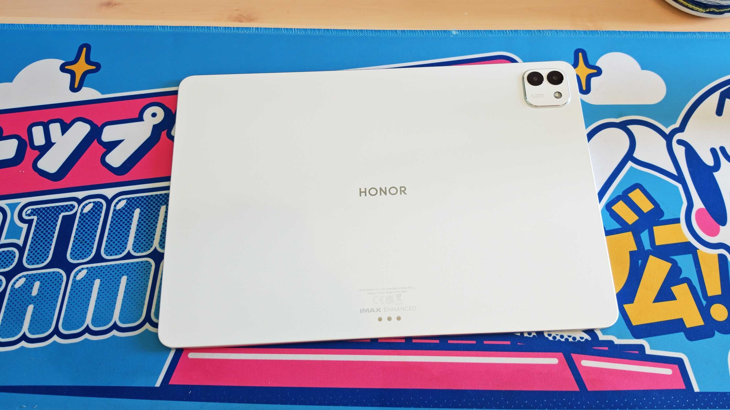 The Honor MagicPad 3 placed on a colorful desk mat.