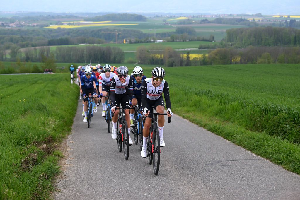 GENVE SWITZERLAND APRIL 30 LR Domen Novak of Slovenia and UAE Team Emirates Nelson Oliveira of Portugal and Movistar Team and Ivo Oliveira of Portugal and UAE Team Emirates lead the peloton during the 76th Tour De Romandie 2023 Stage 5 a 1708km stage from VufflenslaVille to Genve UCIWT on April 30 2023 in Genve Switzerland Photo by Dario BelingheriGetty Images