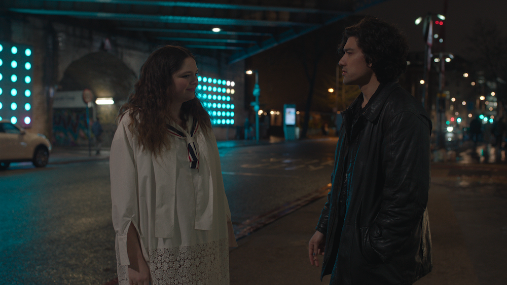 Jess and Felix from Too Much stand on a street together in London