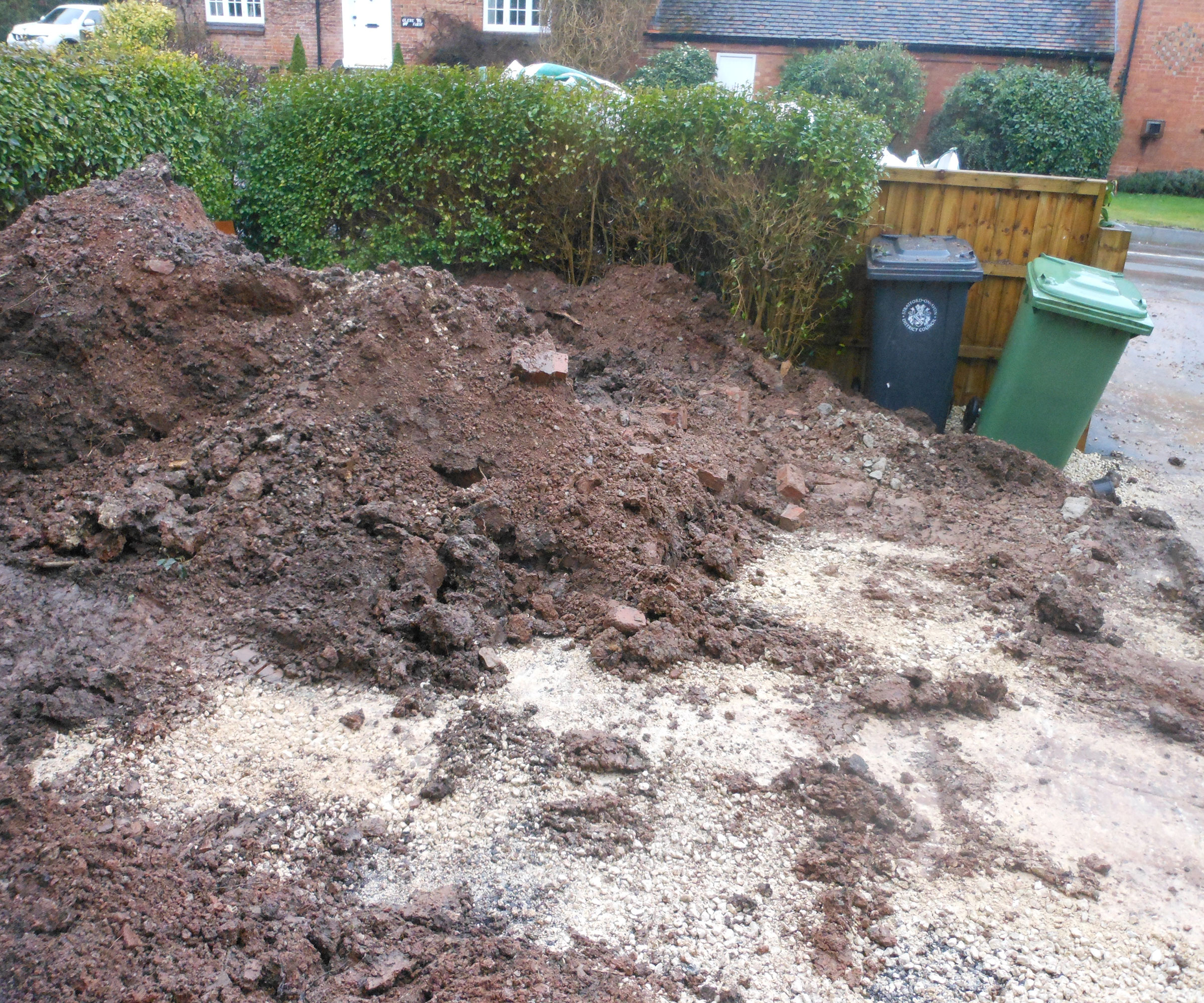 garden being dug up to make new driveway