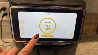 Touching the screen on Kalorik Vivid Touch air fryer