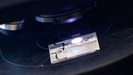 A chip under a scanner at the Center for Heterogeneous and Performance Scaling laboratory
