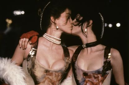 Two models kissing in Vivienne Westwood corsets