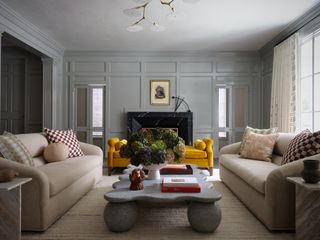 living room with two couches and a stone coffee table