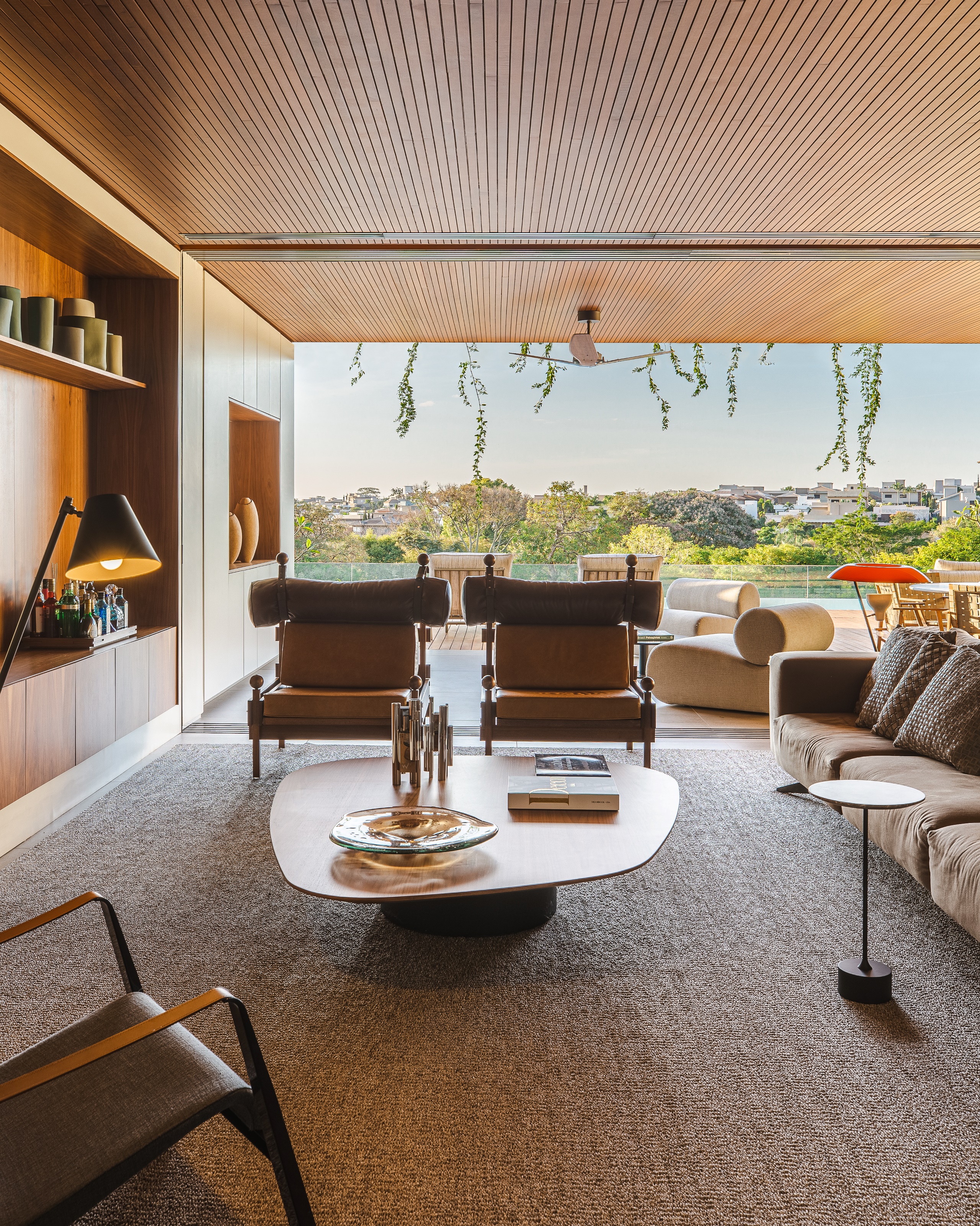 Looking through the two living spaces to the pool beyond