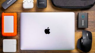 A shot of the best Macbook Pro accessories on a wooden desk