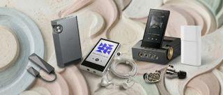 A selection of wired earbuds, hi-res players and headphones on muted background